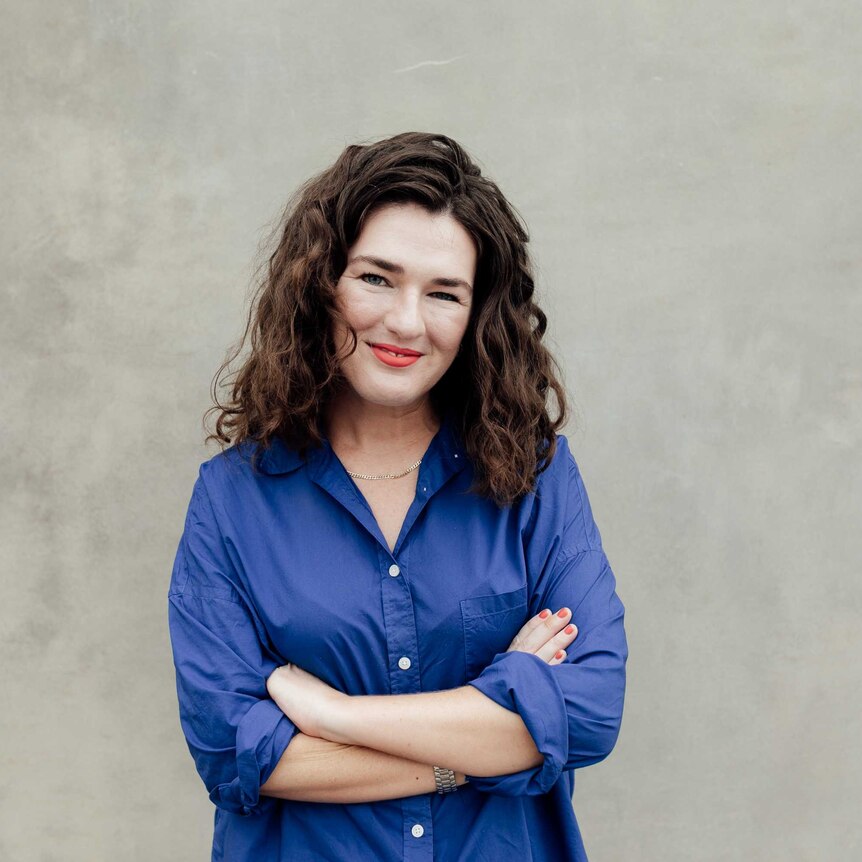 Bridie Jabour smiling in portrait, wearing a blue shirt