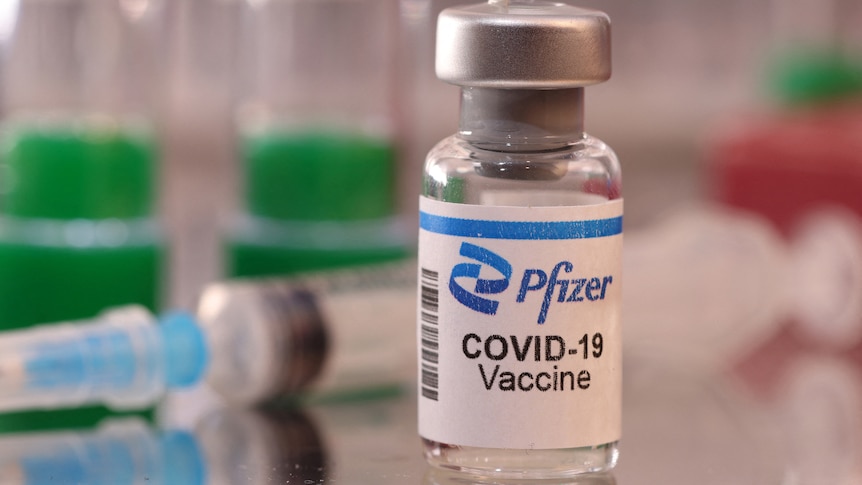 A vial labelled "Pfizer COVID-19 Vaccine".