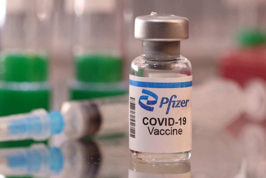 A vial labelled "Pfizer COVID-19 Vaccine".