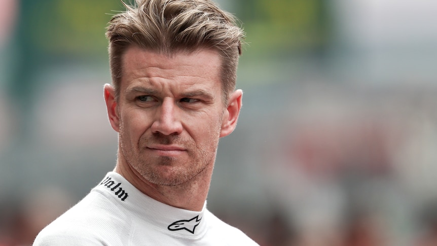 F1 driver Nico Hülkenberg, standing on track during an F1 weekend, looking over his right shoulder