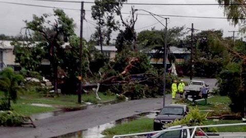 Debris is strewn across Lillypilly Street in Townsville