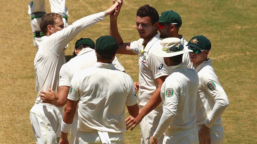 Australia's Josh Hazlewood celebrates the wicket of West Indies' Kemar Roach in Jamaica.
