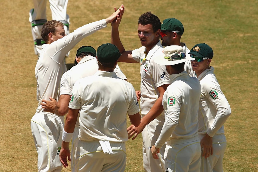 Australia's Josh Hazlewood celebrates the wicket of West Indies' Kemar Roach