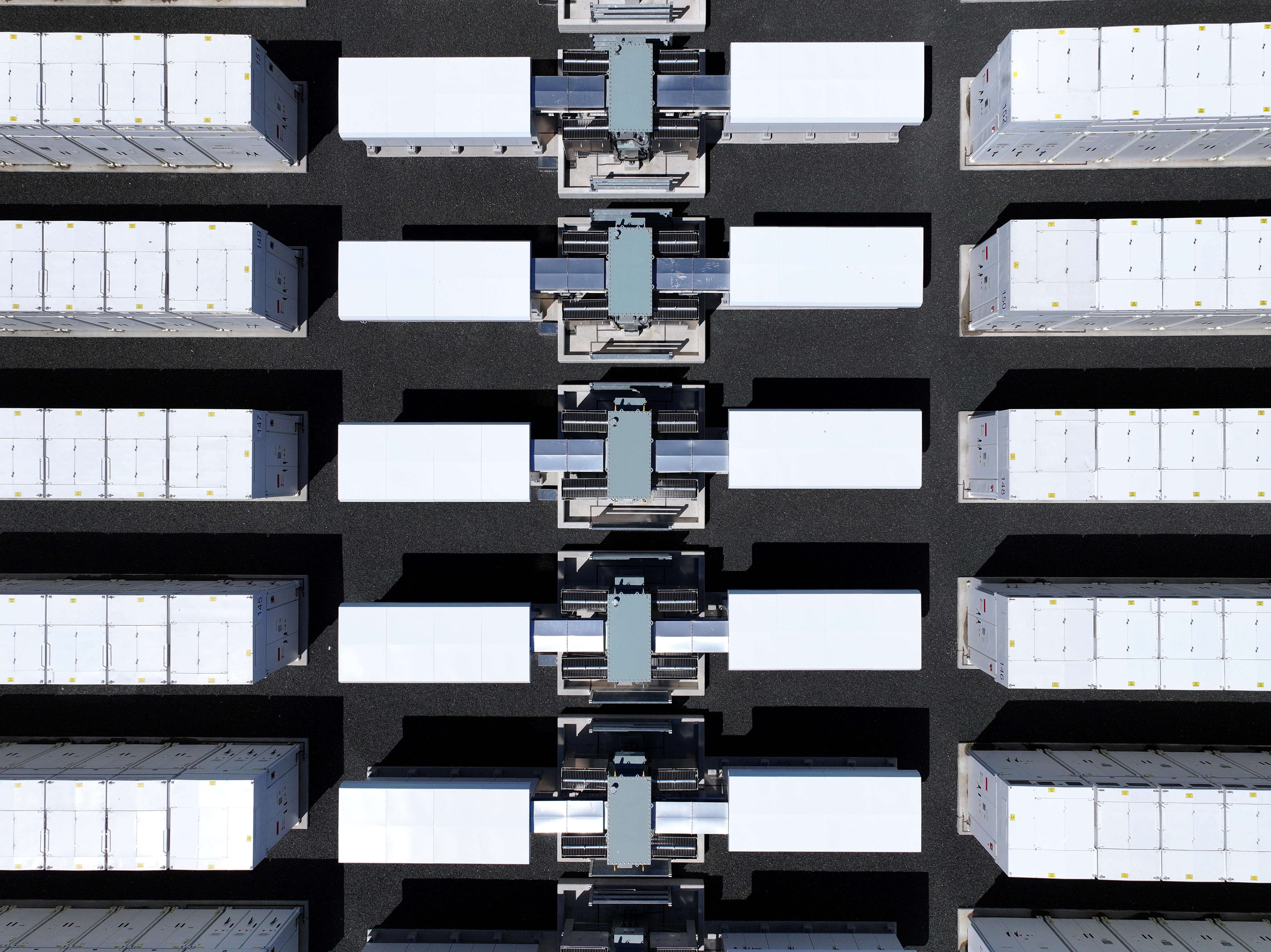Looking down on dozens of small white rectangular buildings