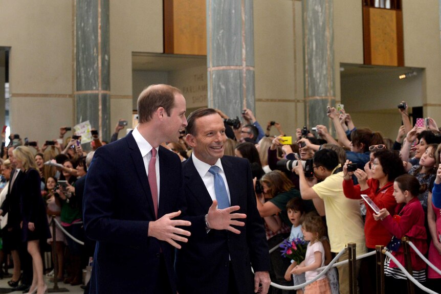 The Duke of Cambridge is escorted through the main entrance of Parliament House by Prime Minister Tony Abbott.