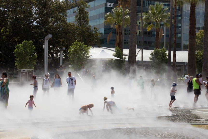 Children play in the Elizabeth Quay water park in Perth.