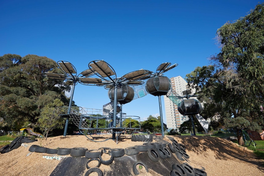 A playground in Fitzroy Melbourne designed to look like tall flowers connected by netted pathways