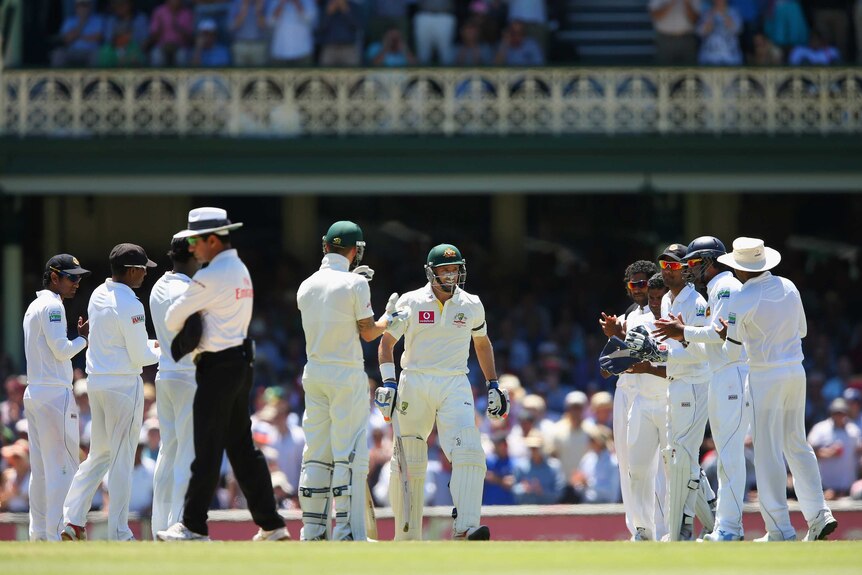 Last stand? Michael Hussey enjoys a guard of honour on his way into the middle.