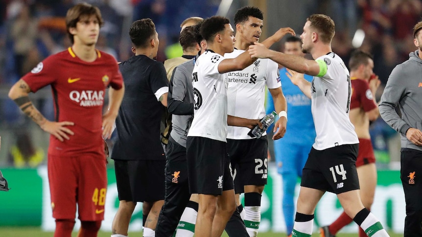 Liverpool players celebrate after beating Roma on aggregate in the Champions League semi-final.