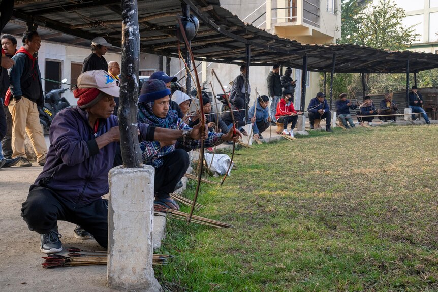 Archers shoot at a hay target at an archery event in Shillong, India