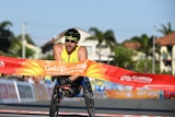 Kurt Fearnley crosses the finish line at the Commonwealth Games on the Gold Coast