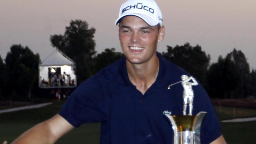 Top of the European money list... Martin Kaymer poses with the Race to Dubai trophy.