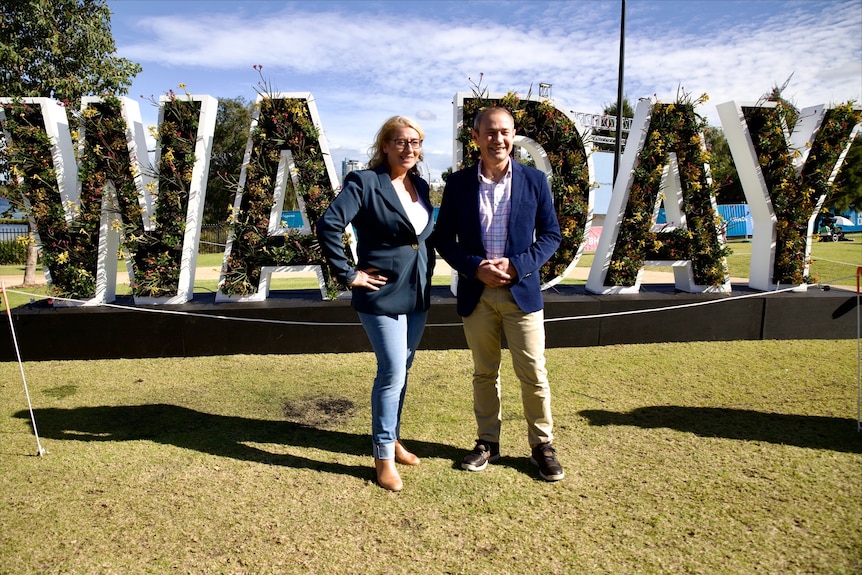 Roger Cook and Rita Saffioti standing in front of a large WA Day sign.