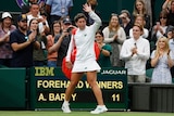 Carla Suarez Navarro waves to a standing ovation from a Wimbledon crowd.