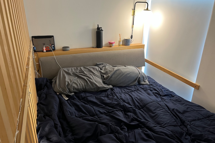 a room that barely fits a bed