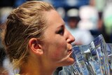 Victoria Azarenka kisses the Indian Wells trophy
