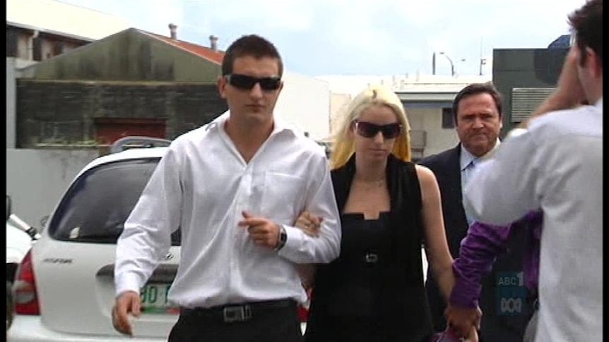 Sergie Brennan (left) and his partner, Tegan Leach (centre), arrive at Cairns District Court on Tuesday.