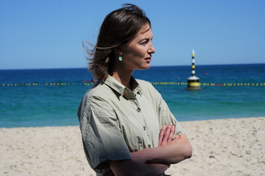 SIde profile of Amy Steel at the beach