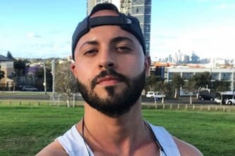 A selfie of Sam Hawli wearing a singlet and cap