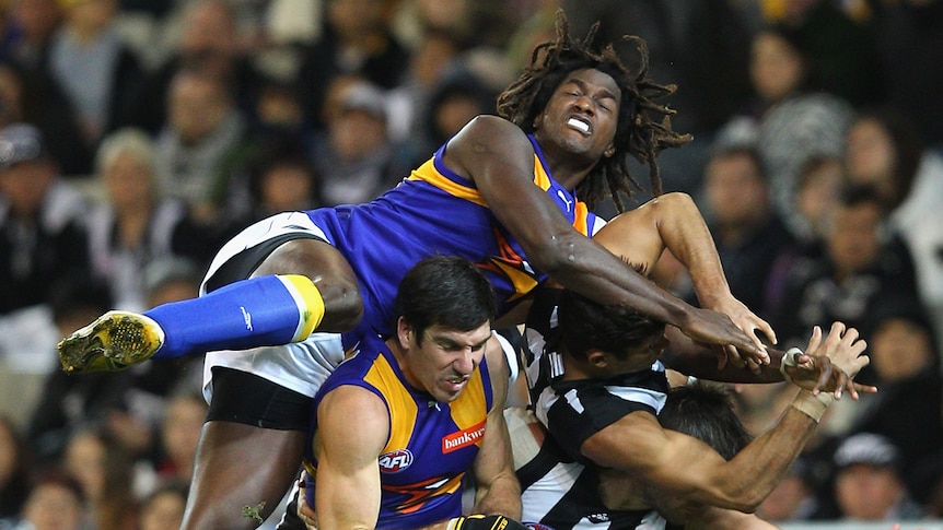 Nic Naitanui flies high for the Eagles at the MCG against  the Magpies.