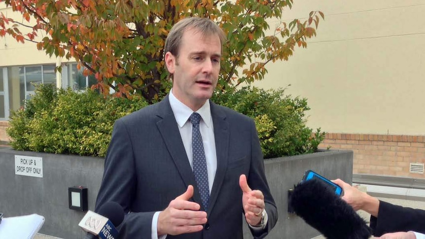 Tasmanian Health Minister Michael Ferguson talks to reporters outside Royal Hobart Hospital.