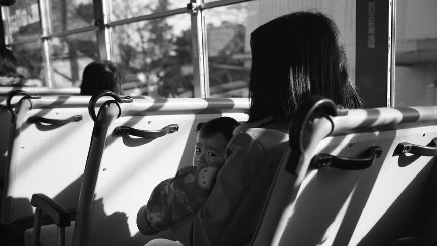 Unidentified mother and child on bus in Japan, December 2006.
