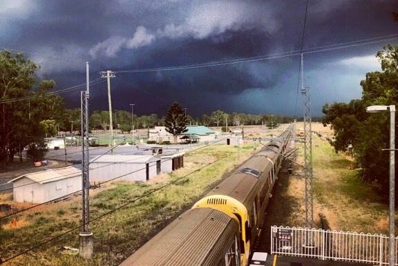 Dark storm clouds roll over Brisbane train and station on March 15, 2019