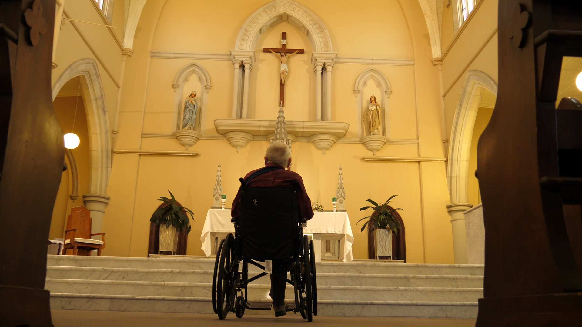 Bill Hayden stares at the cross
