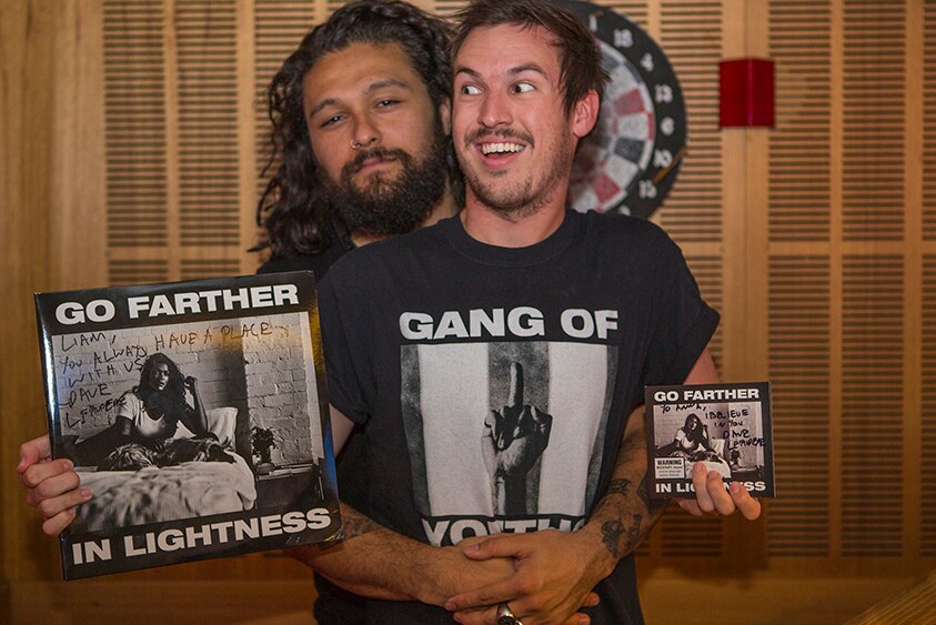 Gang of Youths frontman Dave Le'aupepe with Liam brandishing the band's records on triple j Breakfast