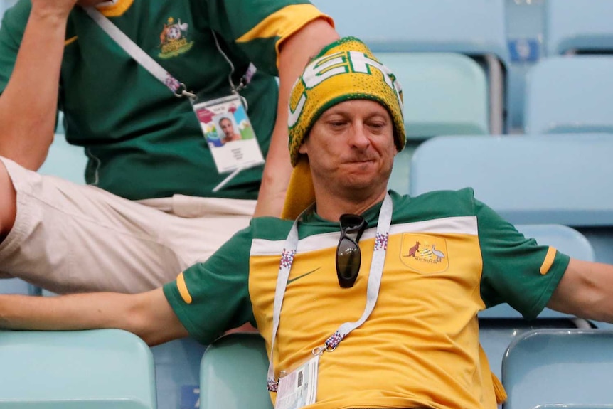 Australian fans look dejected after Socceroos World Cup defeat