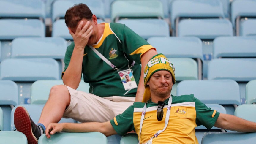 Australian fans look dejected after Socceroos World Cup defeat