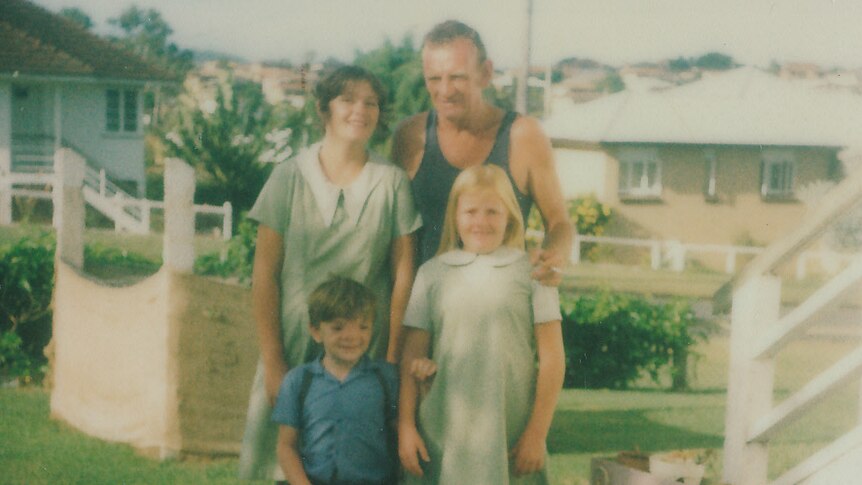 Robert Hoge, with his sisters Catherine and Paula, and father Vince poses before his first day of school.