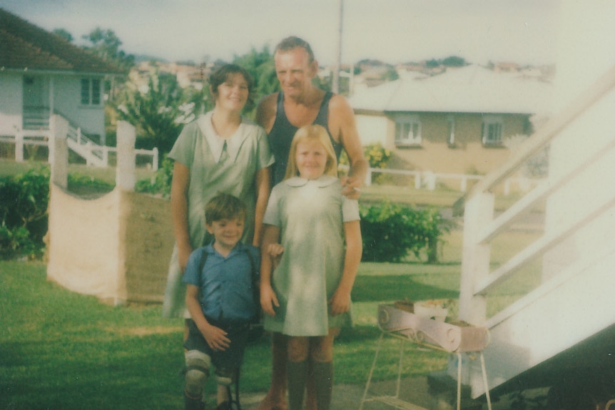 Robert Hoge, with his sisters Catherine and Paula, and father Vince poses before his first day of school.