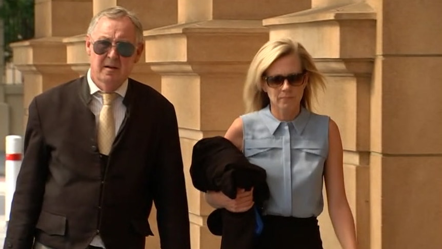 Sonia Ruth Mackay is accompanied by her lawyer as she walks to court.