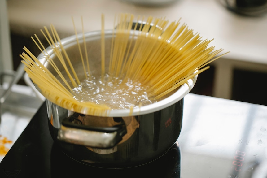 A pot of boiling spaghetti. 