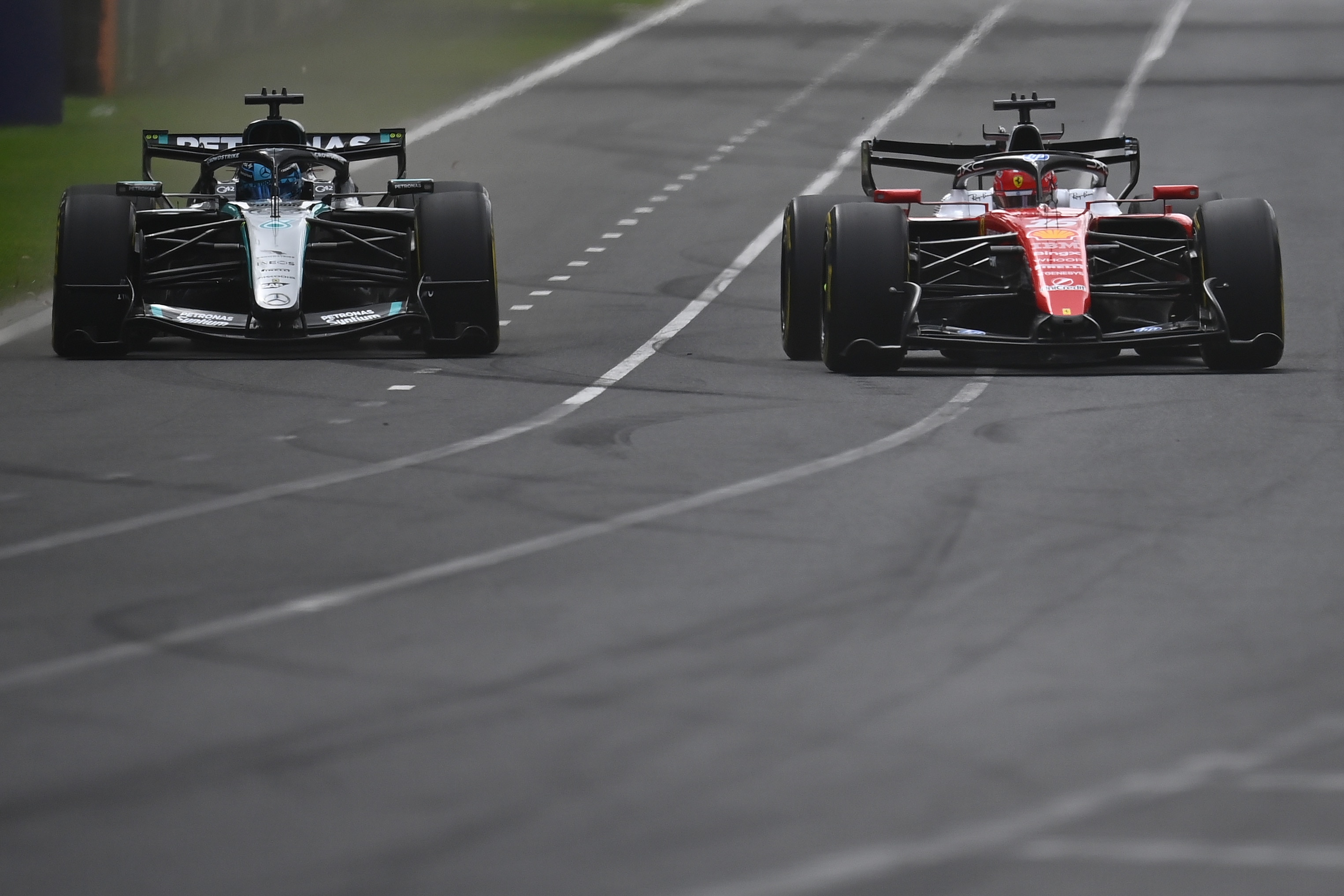 George Russell and Charles Leclerc battle in and F1 race