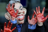 Inquiry opens: a protestor wearing a Tony Blair mask demonstrates in London