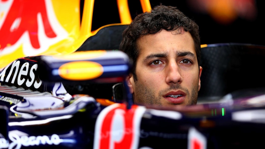 Daniel Ricciardo of Australia and Infiniti Red Bull Racing sits in his car in the garage