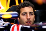 Daniel Ricciardo of Australia and Infiniti Red Bull Racing sits in his car in the garage