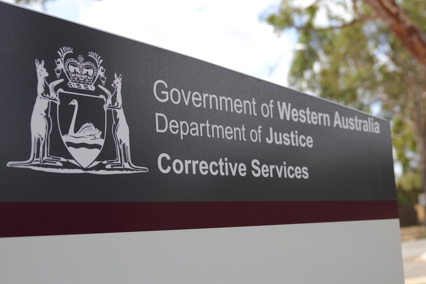 A sign that says' Government of Western Australia Deparment of Justice Corrective Services'. 