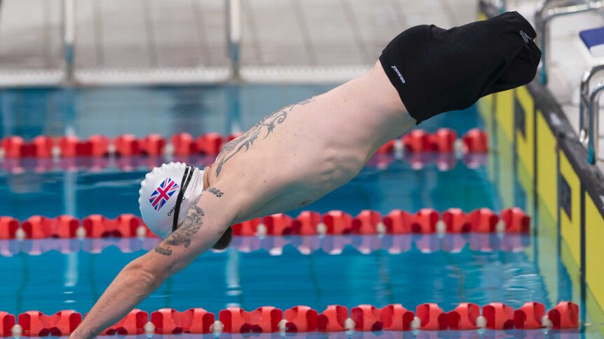 Mark Ormrod dives into the pool at the Invictus Games