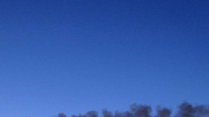 Smoke drifts across the skyline of Mt Isa.