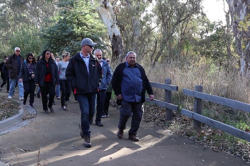 Uncle Ruben guides locals on a special walk through 'The Flats'