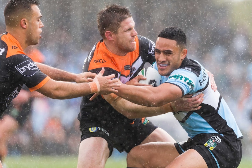 Valentine Holmes barges at the Tigers defence