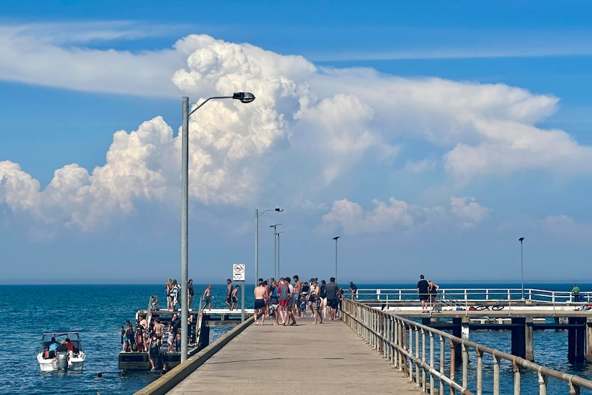 Storms build at end of jetty in St Leonards, Victoria