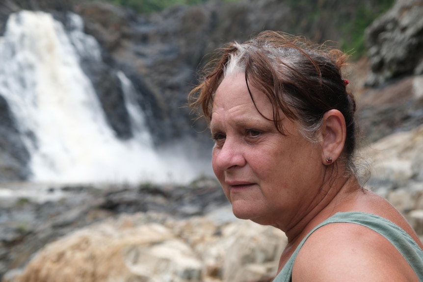 A woman near waterfalls.
