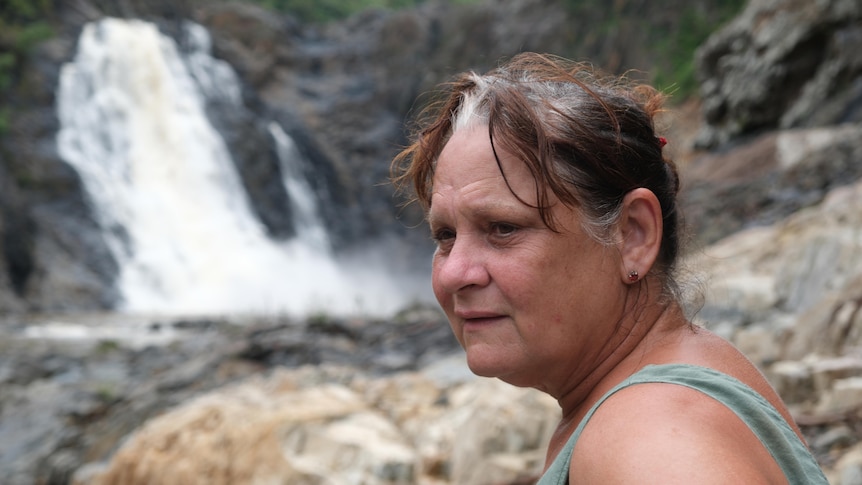 A woman near waterfalls.