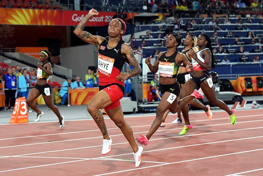 Michelle-Lee Ahye of Trinidad and Tobago wins the women's 100m at the Commonwealth Games.