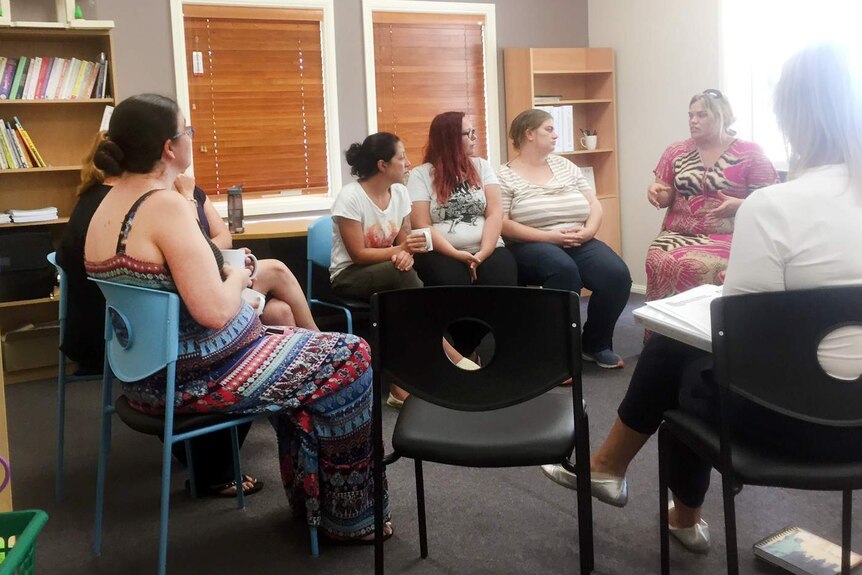 A group of women sitting.