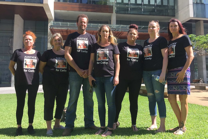Seven supporters wear "Justice for Corby" shirts outside the Supreme Court in Brisbane.